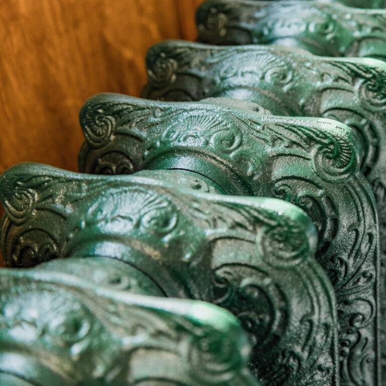 Ornate cast iron radiator in Little Greene paint