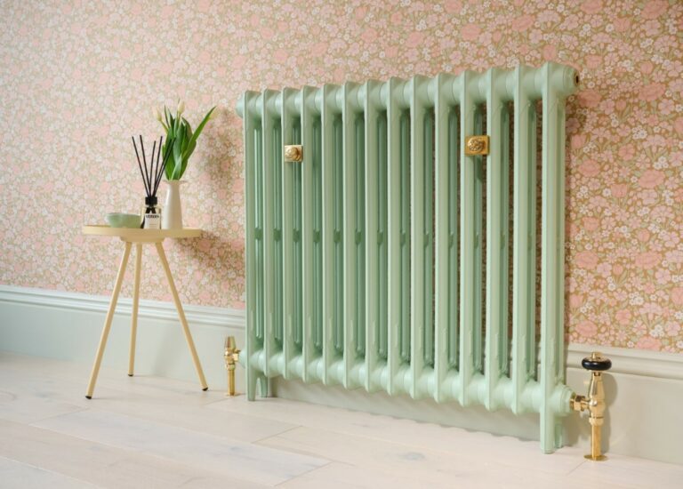 Mercury 2 Column 760mm cast iron radiator finished in Little Greene Peagreen alongside Castrads' Unlacquered Brass accessories