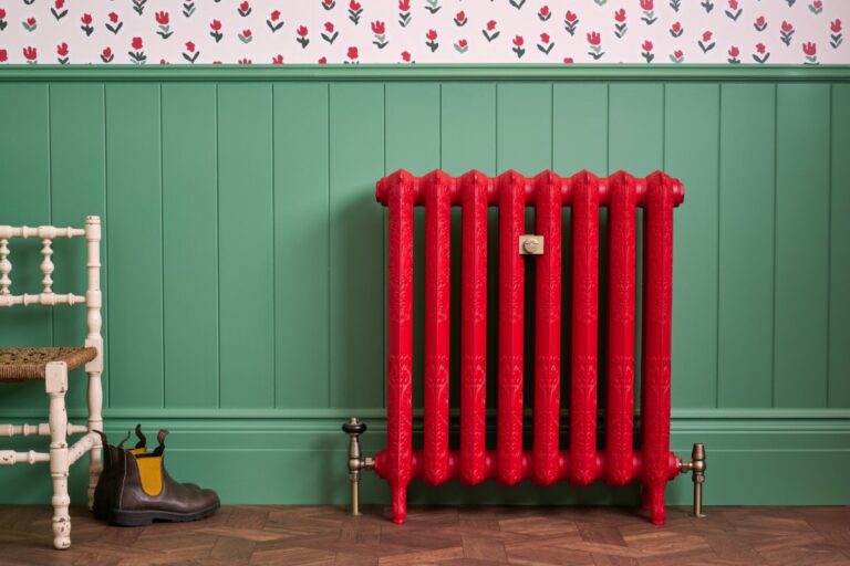 Rococo II 760mm cast iron radiator in Benjamin Moore Heritage Red, matched with the Windsor Angled TRV and Whitworth Wall Stay